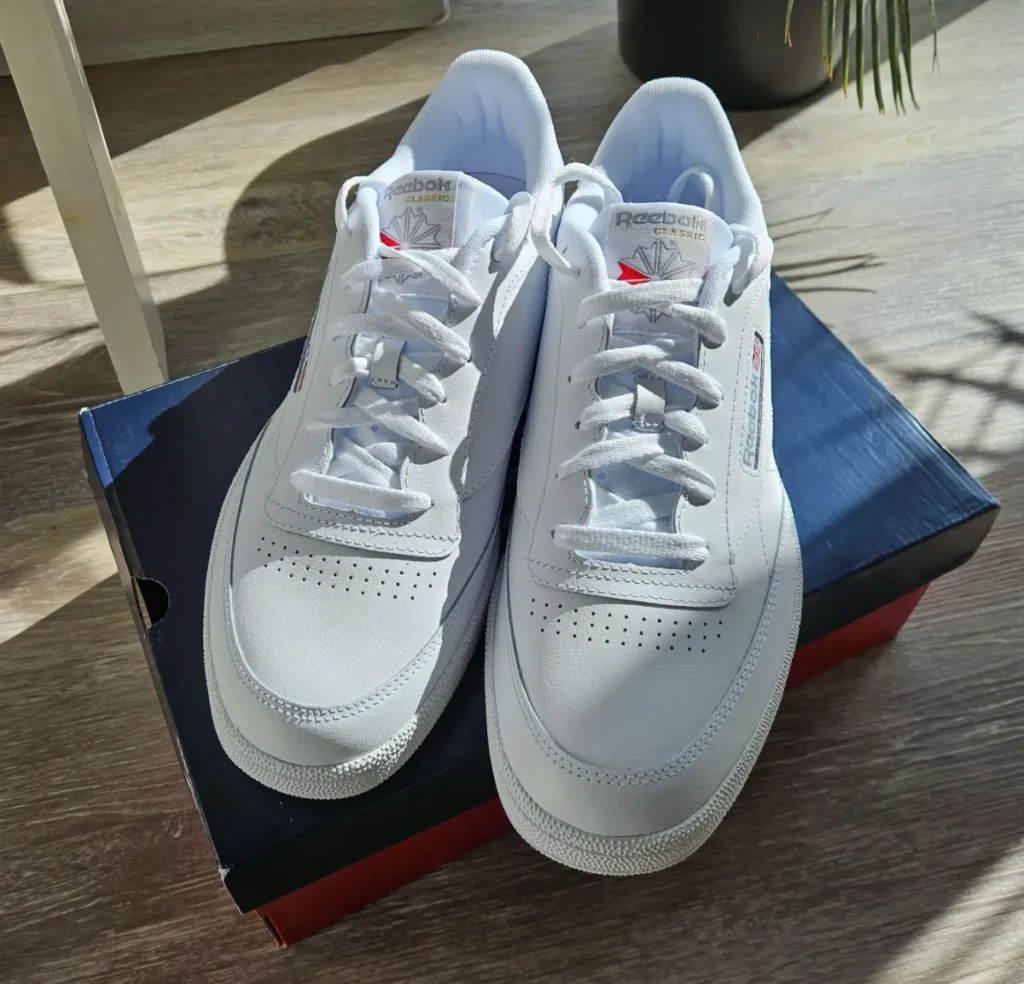 My own white Reebok Club C 85, showing the Reebok Classic tongue tag, side vector logo, and Union Jack.